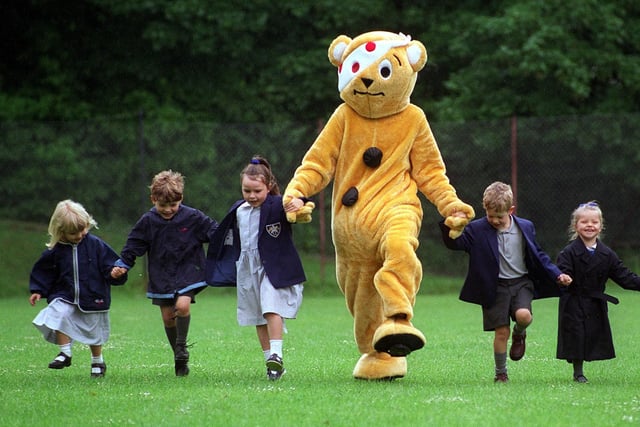 June 1997 and Pudsey's Fulneck School held a teddy bears garden party officially opened by Pudsey Bear. Pictured are Katie Spealce, Joshua Pitts, Emma Corson, Adam Lightbody  and Lucy Butler