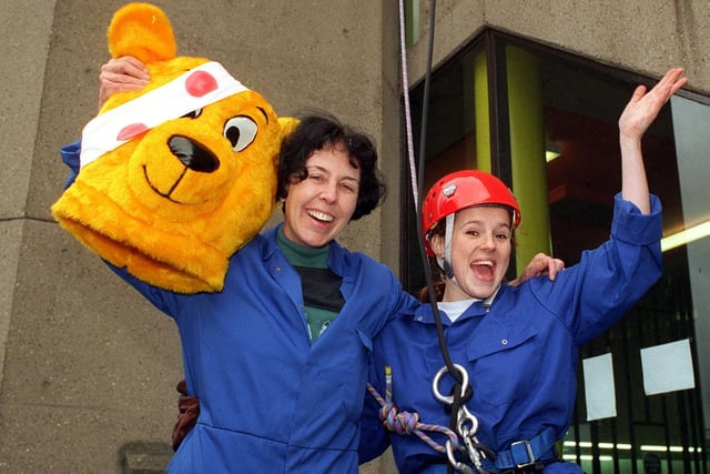 Employees of Pudsey Personnel employment agency -  Liz Navin-Jones and Rachel Dawber-  are elated after abseiling down the side of the YEP building to raise cash for Children in Need in November 1995.