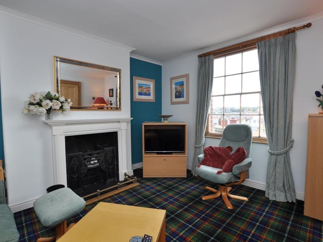 Another room with charm, and a Georgian window that looks out over the town.