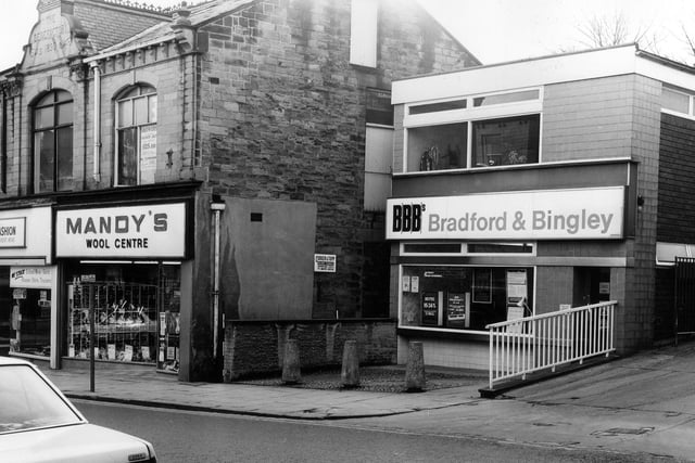 Shops at the southern end of Queen Street, close to the junction with Fountain Street pictured in March 1982. On the left is Khalid Fashions and Mandy's Wool Centre, both of which occupy a building known as The Benefactory.