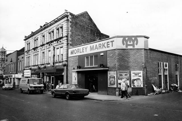 On the far left of this photo dating back to March 1982 a discount store stands at the junction with Albion Street. Along this parade of shops is Althams travel services, Green's Pork Butchers, both business's still trading in the area. Also here is Stanways Hosiery and an entrance to Morley Market.