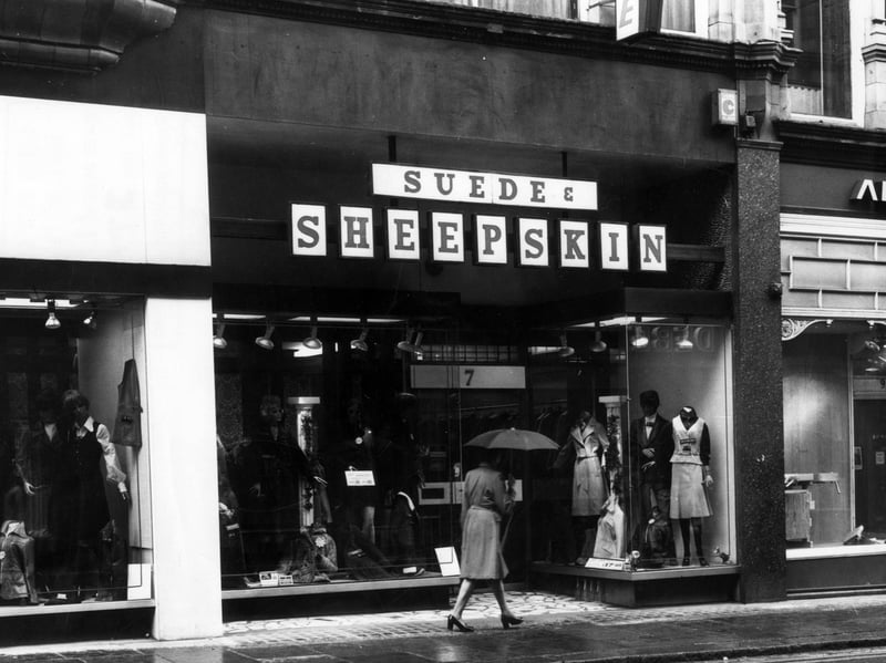 Suede and Sheepskin shop on King Edward Street in Leeds city centre pictured in May 1976. The shop was located there  from circa 1963 to 1983. To the right is Alvin Morris Ltd., decorators' supplies showroom.