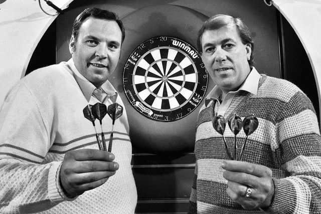 World darts stars Cliff Lazarenko, left, and John Lowe ready to compete at the LUT buses depot in Atherton, 1984
