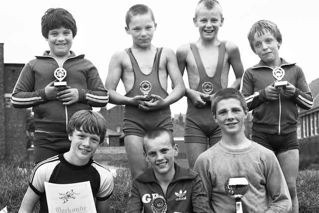 Young wrestlers from Riley's Gym in Whelley who gained overall 2nd place in an international tournament in Belgium in June 1983.
The lads are, front, left to right, Warren Moorfield, John Hughes and Paddy Goven. Back, left to right, Terry Goven, Tony Leyland, Neil Maxwell and Anthony Wooley.