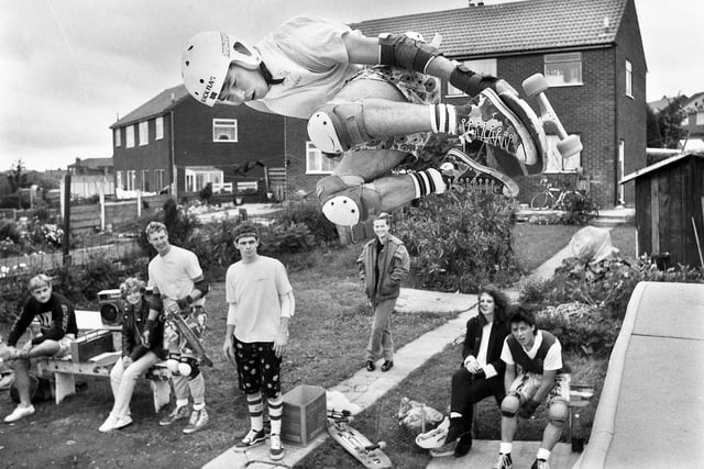Skateboarding on a ramp set up in an Ince back garden on Sunday 1st of September 1985.