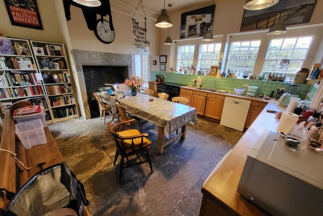 There is space for a large table and chairs within this well equipped kitchen.
