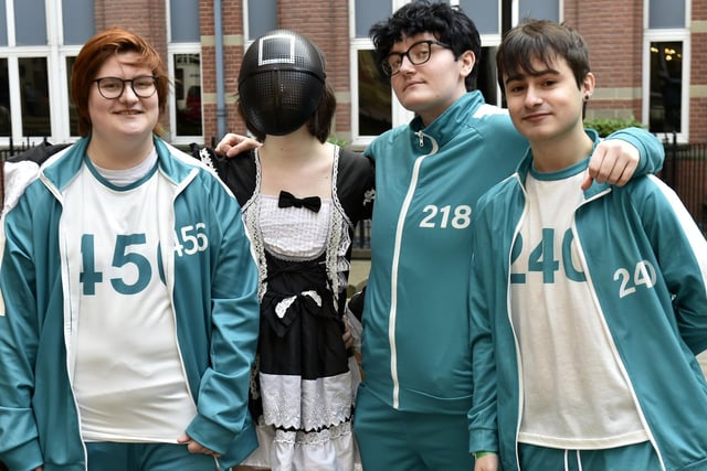 Friends dressed as squid game characters