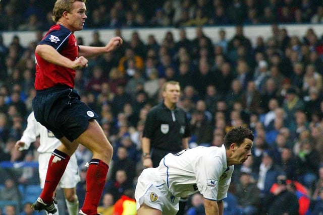 Bolton striker Kevin Davies scores the opening goal as Ian Harte looks on.
