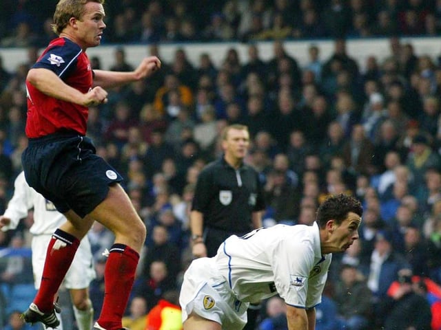 Bolton striker Kevin Davies scores the opening goal as Ian Harte looks on.