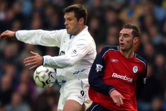 Mark Viduka controls the ball under pressure from Bolton's Nicky Hunt.