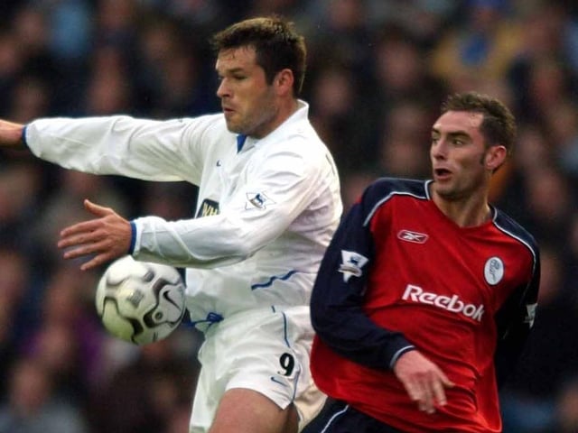 Mark Viduka controls the ball under pressure from Bolton's Nicky Hunt.