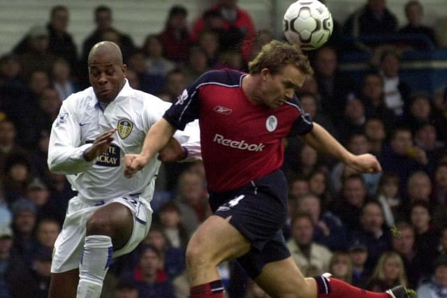 Kevin Davies heads the ball away from Michael Duberry.