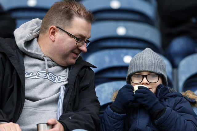 These PNE fans keep warm at the Cardiff game with a hot drink