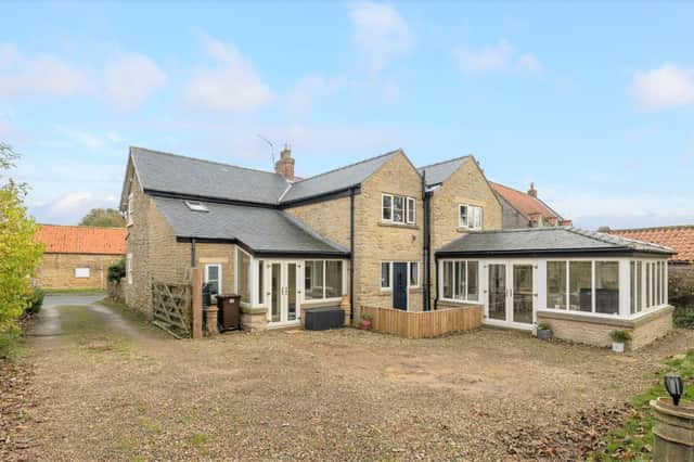 This sizeable home includes an annexe and a detached home office among its many facilities.