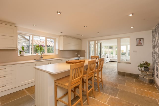 The bright and spacious kitchen that leads through to the orangery.