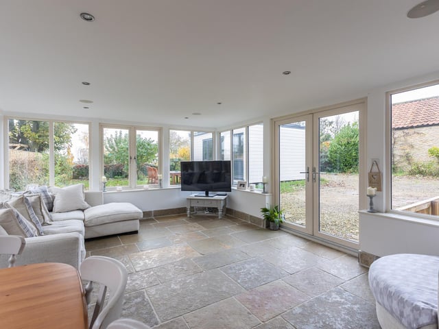 This versatile room has double doors that lead outside - perfect for summer weather and entertaining.