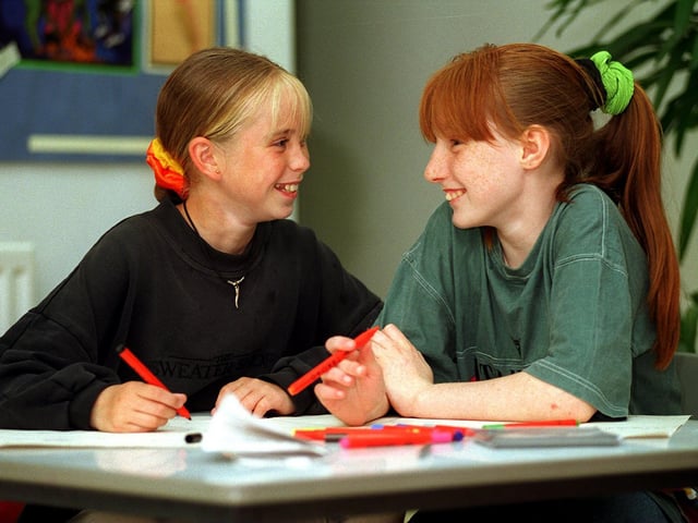 Greenmount Primary pupils Janet Barber (left) and Sarah Allison won a competition in July 1996 to design the poster for Cross Flatts Community Festival.