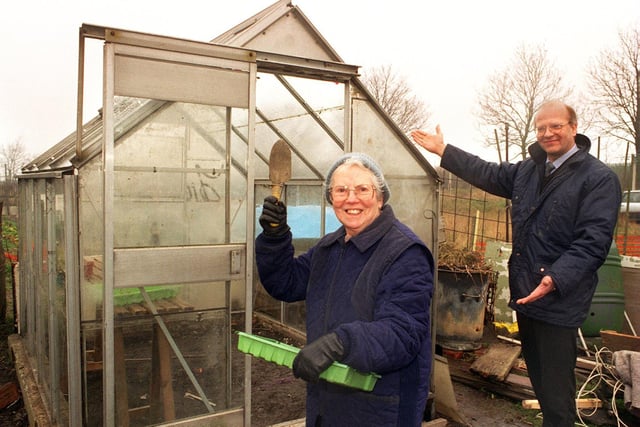 Anne Lageu's greenhouse was stolen from her Beeston allotment in March 1996. She was delighted when an anonymous well wisher donated another one to her. Pictured is Richard Catlow, a director of John Catlow and Son, Leeds Ltd who transported the new greenhouse, invites Mrs Lageu to step inside her replacement.