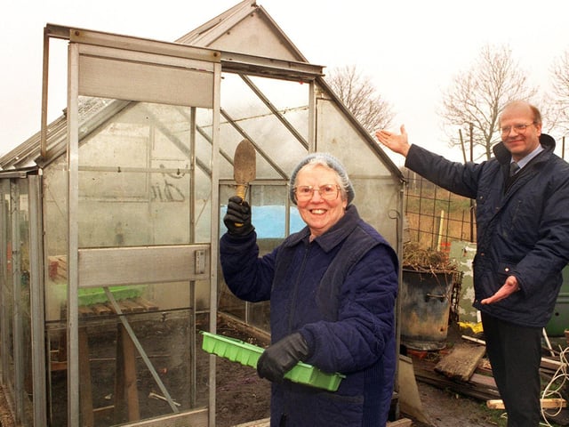 Anne Lageu's greenhouse was stolen from her Beeston allotment in March 1996. She was delighted when an anonymous well wisher donated another one to her. Pictured is Richard Catlow, a director of John Catlow and Son, Leeds Ltd who transported the new greenhouse, invites Mrs Lageu to step inside her replacement.