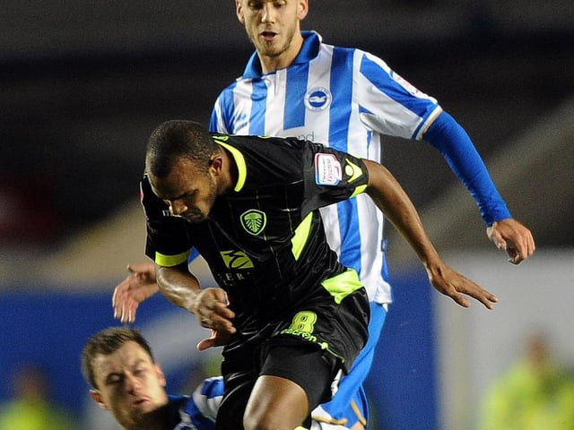 Rodolph Austin is fouled by Brighton's Ashley Barnes.
