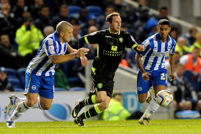 Aidy White drives through the heart of the Brighton midfield.