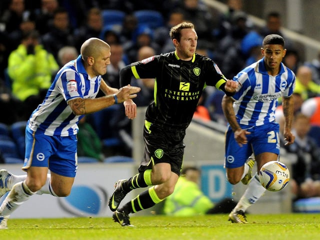 Aidy White drives through the heart of the Brighton midfield.