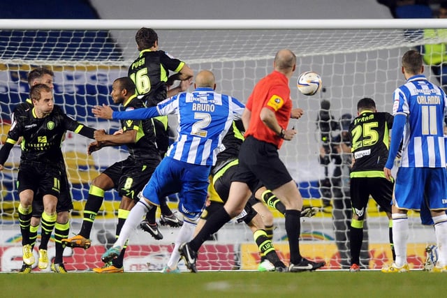 Brighton's Bruno Saltor fires a free-kick over the bar past the Leeds United defensive wall.