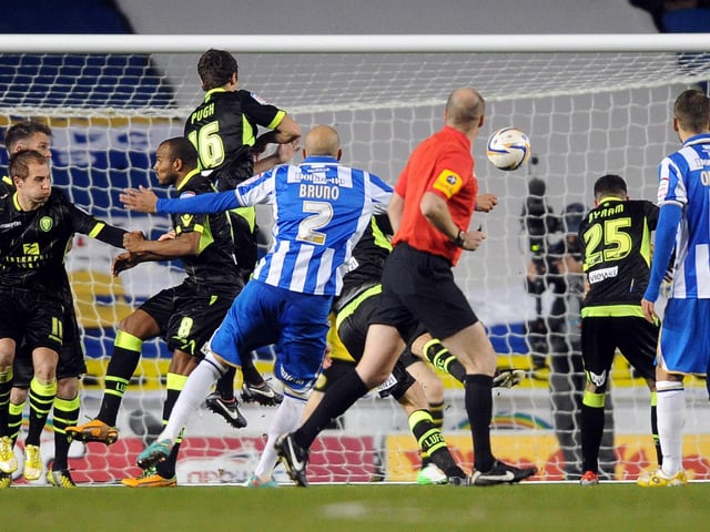 Brighton's Bruno Saltor fires a free-kick over the bar past the Leeds United defensive wall.