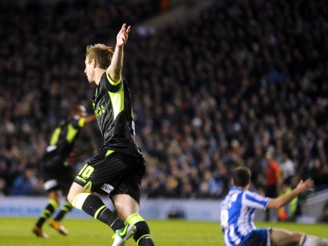Luciano Becchio turns to celebrate after Michael Brown equalised for the Whites.