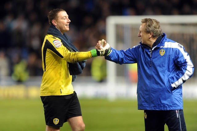 Manager Neil Warnock congratulates Paddy Kenny for his heroics at full-time.