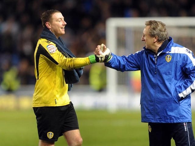 Manager Neil Warnock congratulates Paddy Kenny for his heroics at full-time.