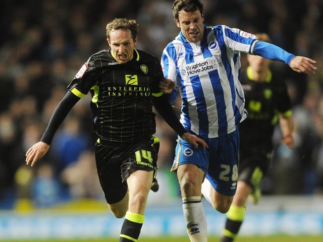 Aidy White takes on Brighton's Wayne Bridge.