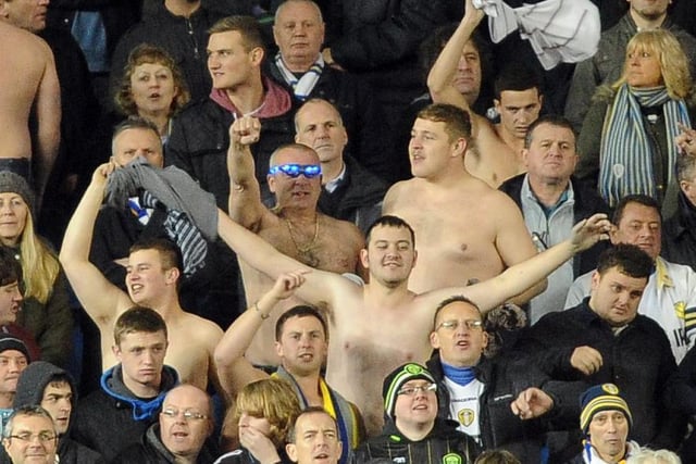 Shirts off for Leeds United's travelling support despite the cold conditions.