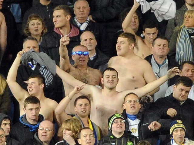Shirts off for Leeds United's travelling support despite the cold conditions.