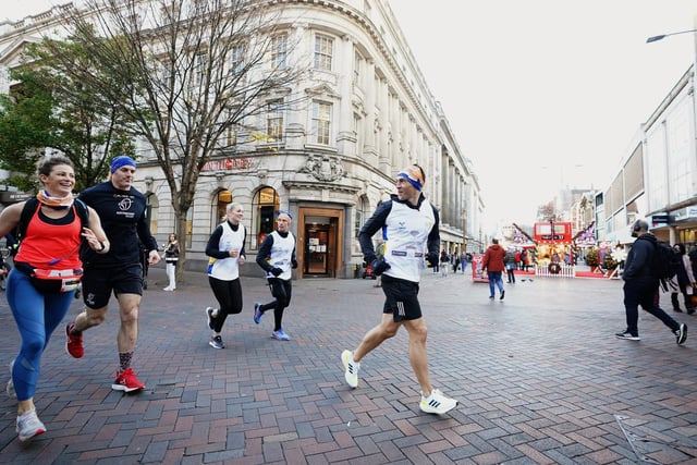 Kevin Sinfield crosses Long Row in Nottingham city centre during the Extra Mile Challenge.