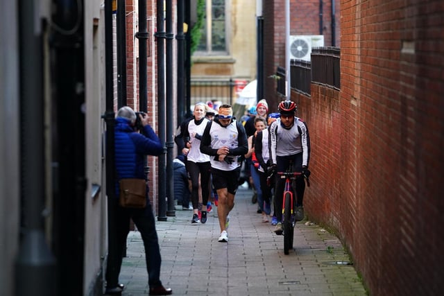Kevin Sinfield sets off from the seventh stop in Nottingham city centre during the Extra Mile Challenge