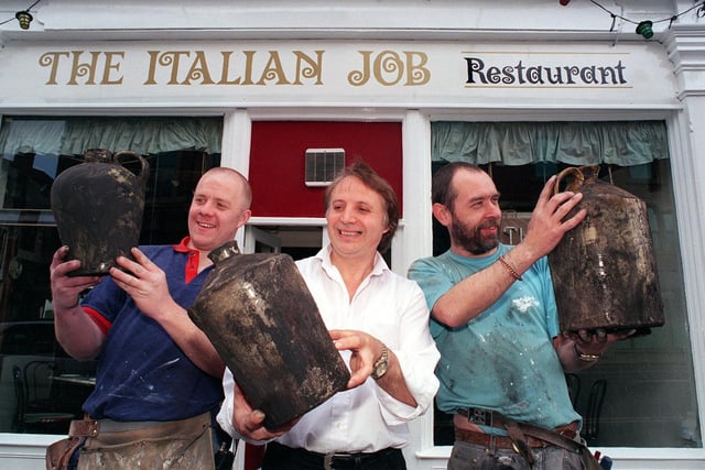 Egyptian vases found by joiners Stephen Rutter, (left) and Mark Lee (right) while renovating city centre restaurant The Italian Job. Pictured in the centre is restaurant manager Domenico Roberto.