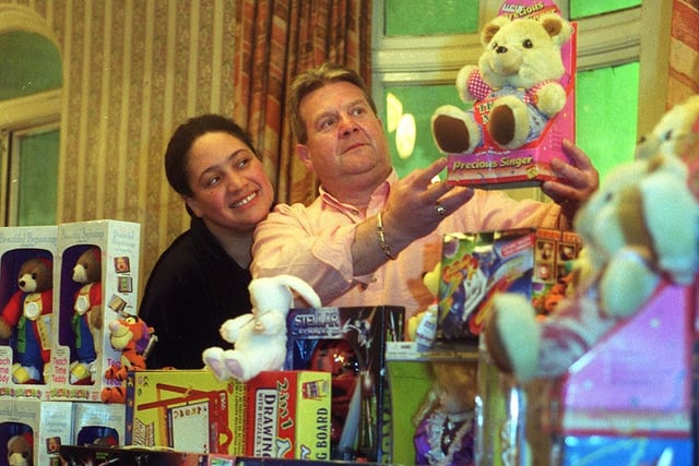 Three Legs pub Karoke presenter 'Big Jackie' and landlord Geoff Rose, display the toys for Leeds hospitals in December 1999.