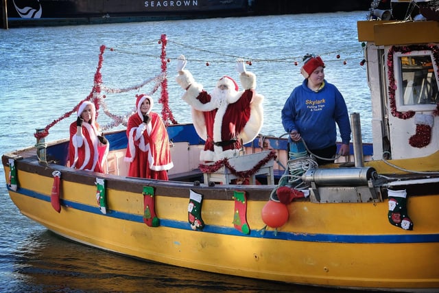 Santa waves to the crowd