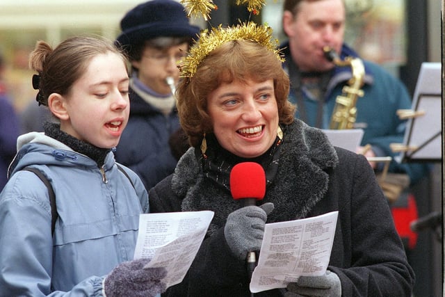 Diane Rose (right ) and Katie Martin of the Destiny Christian Church sing carols for shoppers on Kirkgate in December 2000.