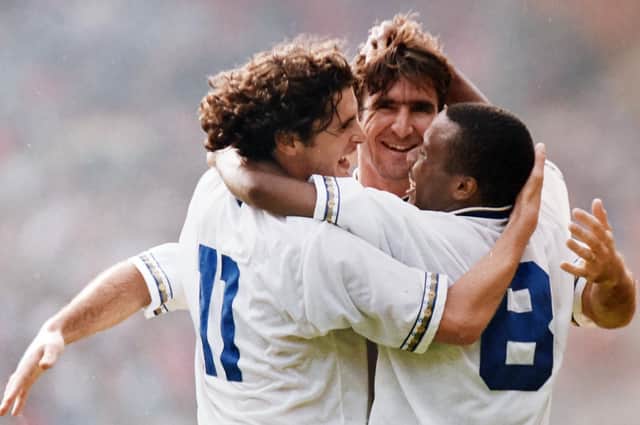 Gary Speed and Rod Wallace celebrate with hat-trick scorer Eric Cantona as Leeds United claim a 4-3 victory over Liverpool in the 1992 Charity Shield.