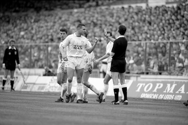 Vinnie Jones makes his point to the referee.