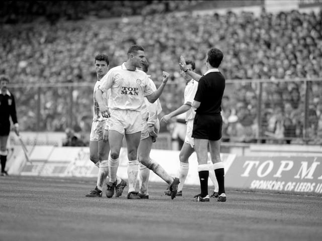 Vinnie Jones makes his point to the referee.