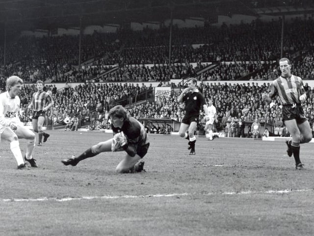 Gordon Strachan sees his effort saved by the Bradford City goalkeeper.
