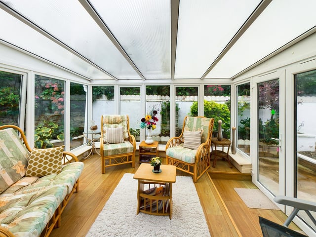 A roomy addition to the home that is perfect for relaxation or entertaining guests.