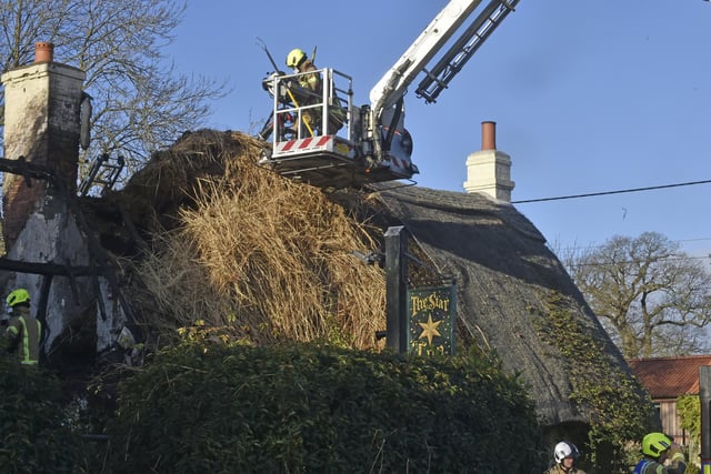 The highly flammable thatch is being removed