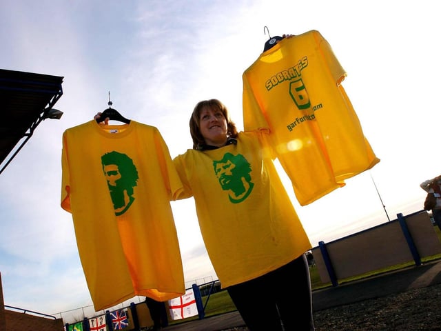 Socrates t-shirts are sold outside Wheatley Park ahead of his debut.