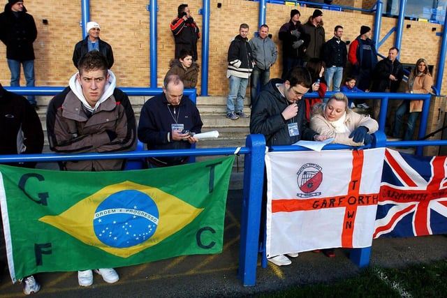 English and Brazilian flags are placed on the terraces at Garforth Town ahead of his debut for the non-league side.