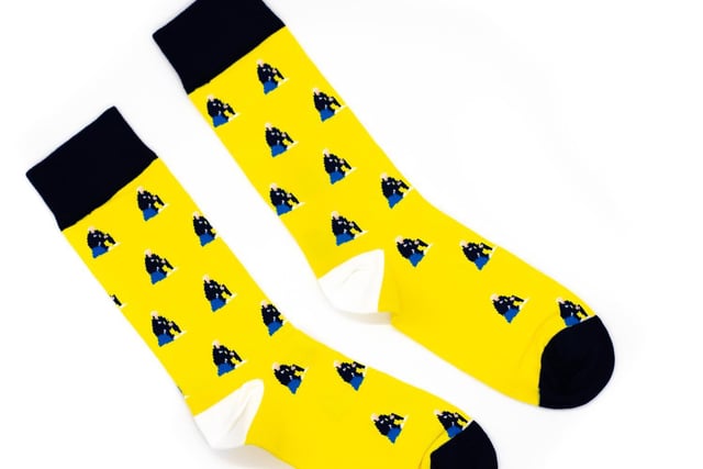 You'll be sure to turn heads with these striking socks featuring El Loco and his favourite blue bucket. 

Available to buy at https://sockcouncil.com/product/el-loco-socks/
