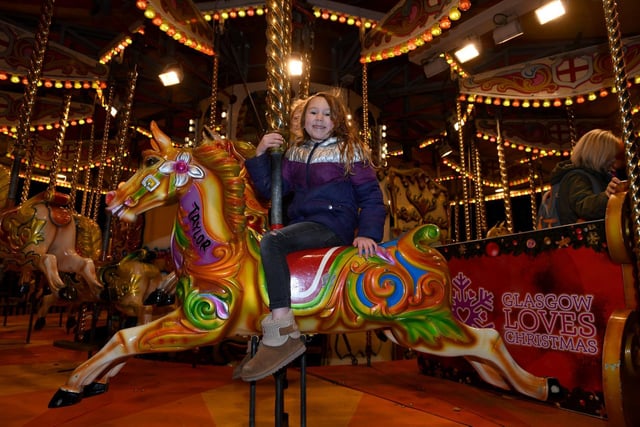 Imogen Mercer (aged 5) on the carousel down at Crescent Gardens
